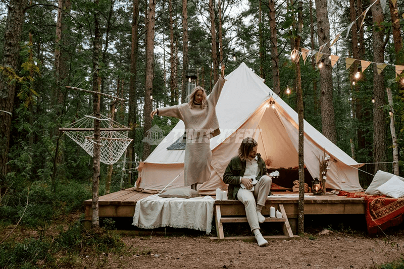 Couple glamping in a forest